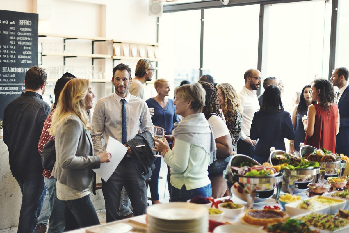 people mingling at office event