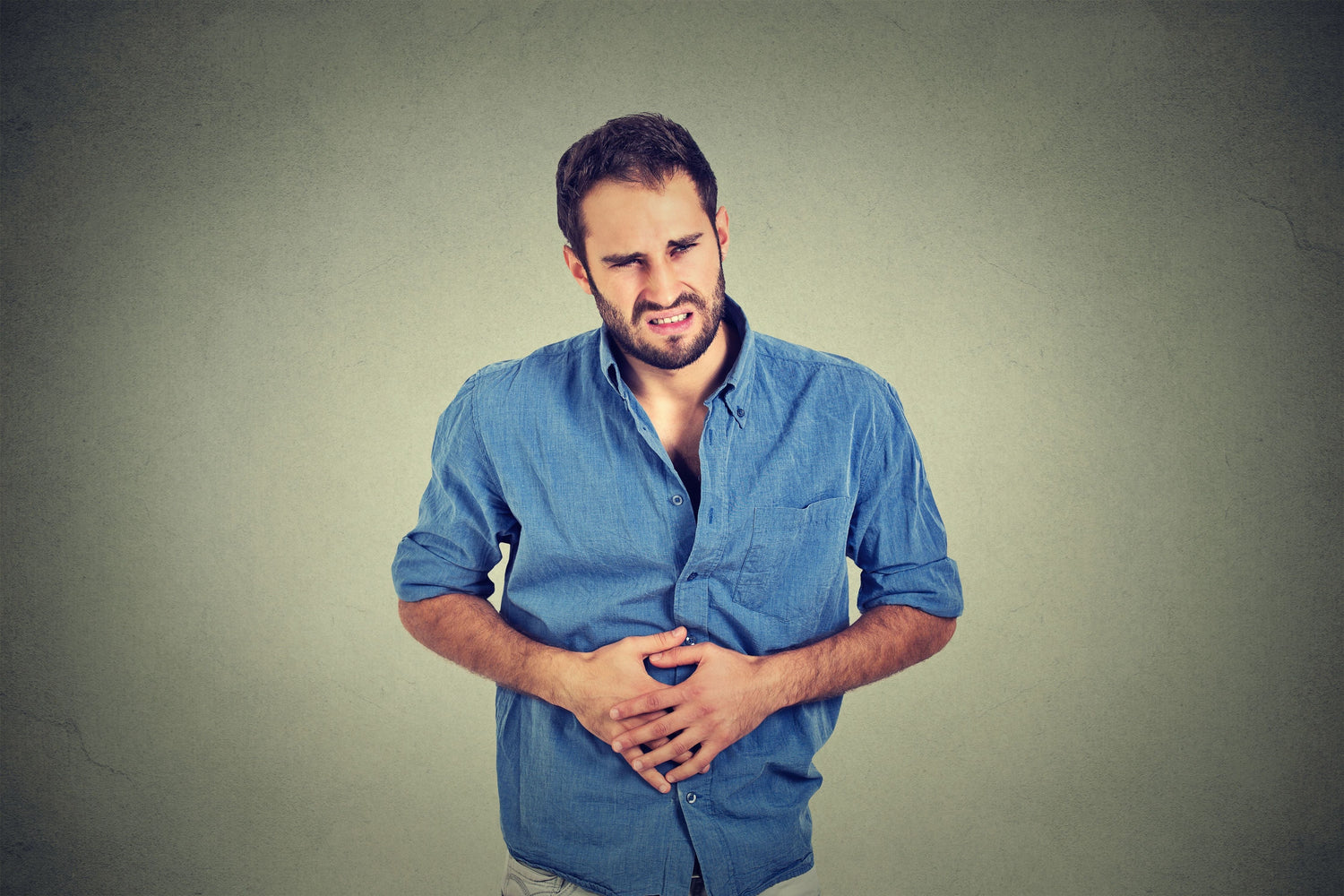 man holding his stomach