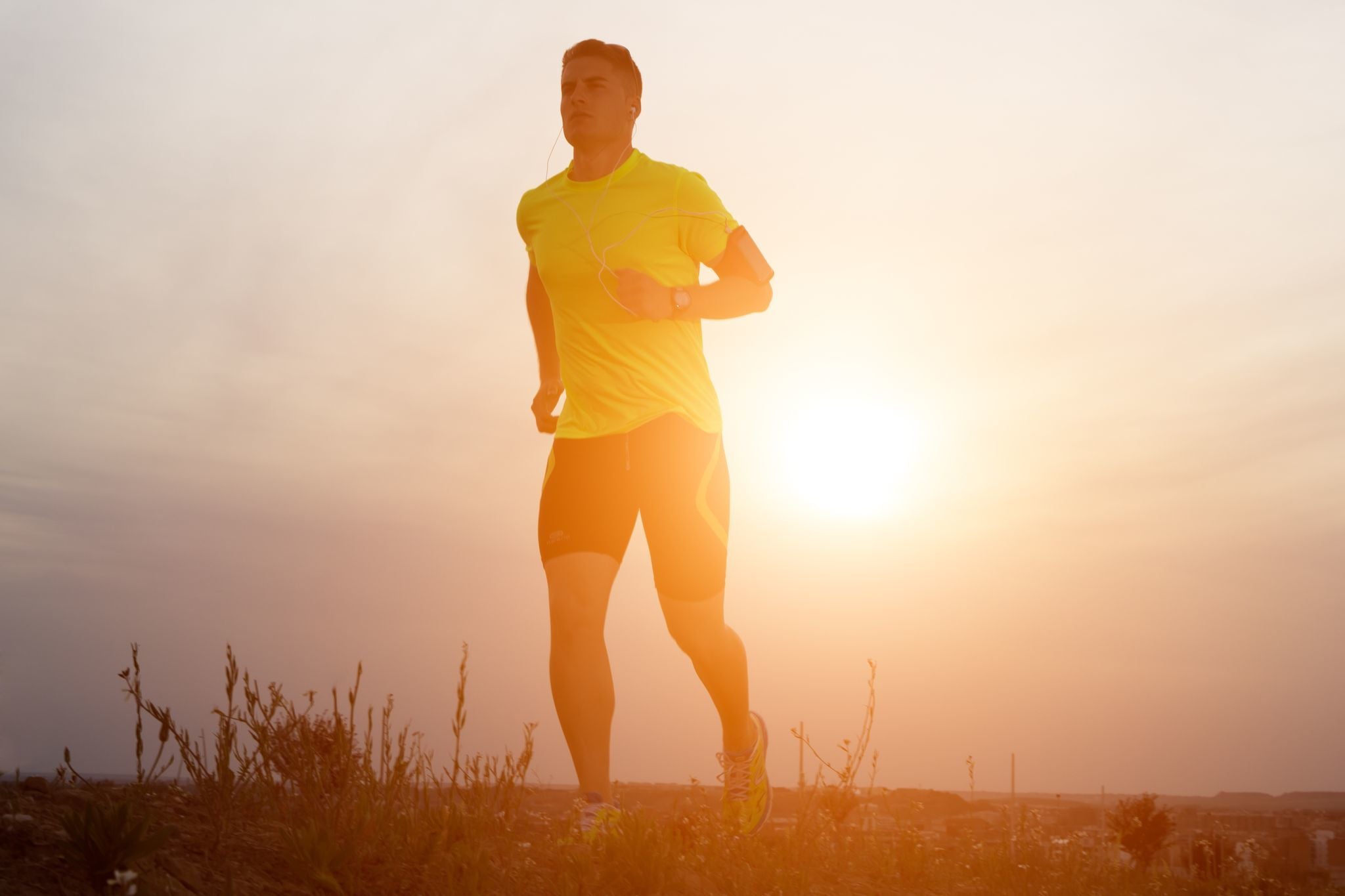 man running in sunset