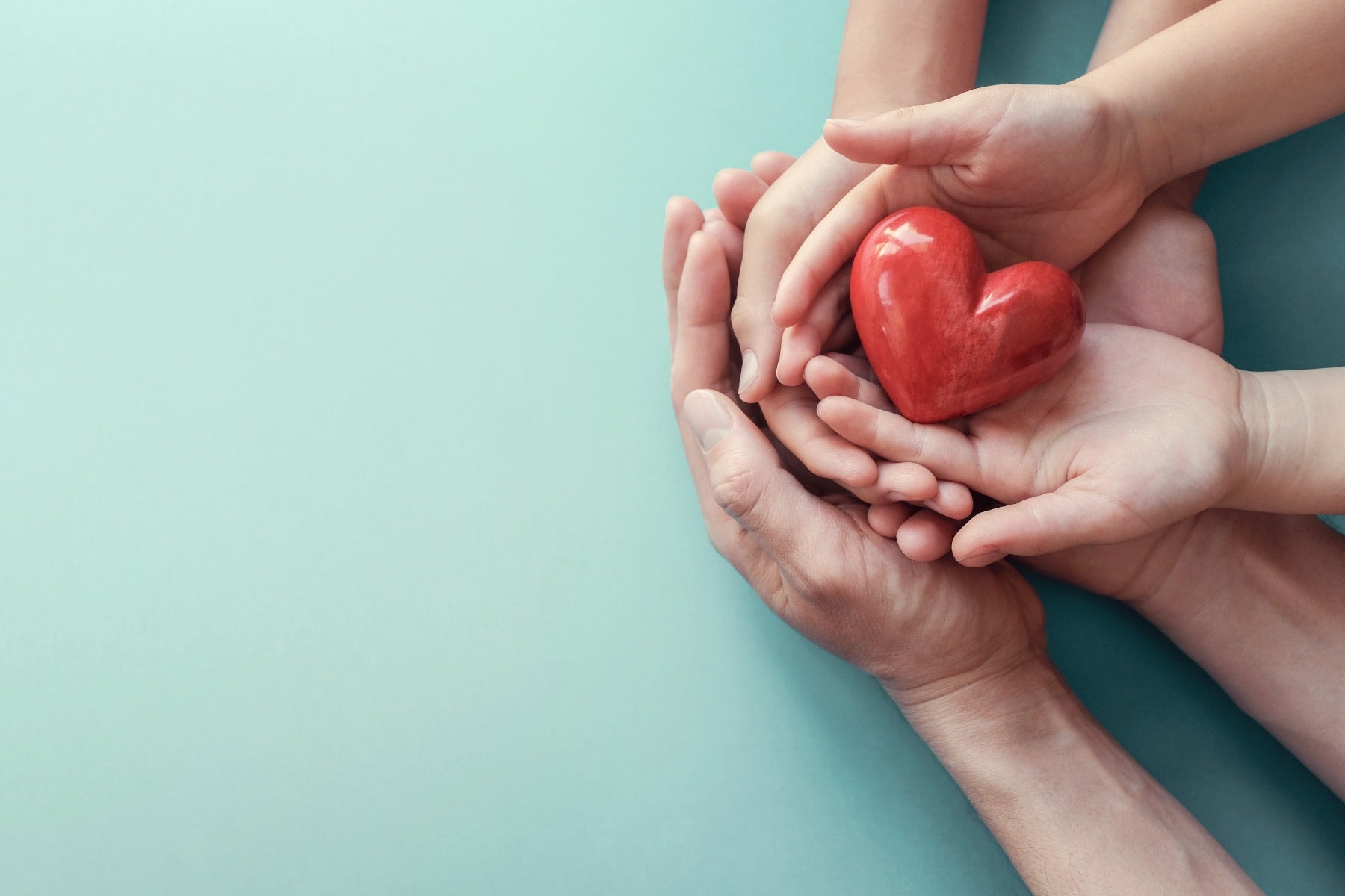 multiple hands and a heart object