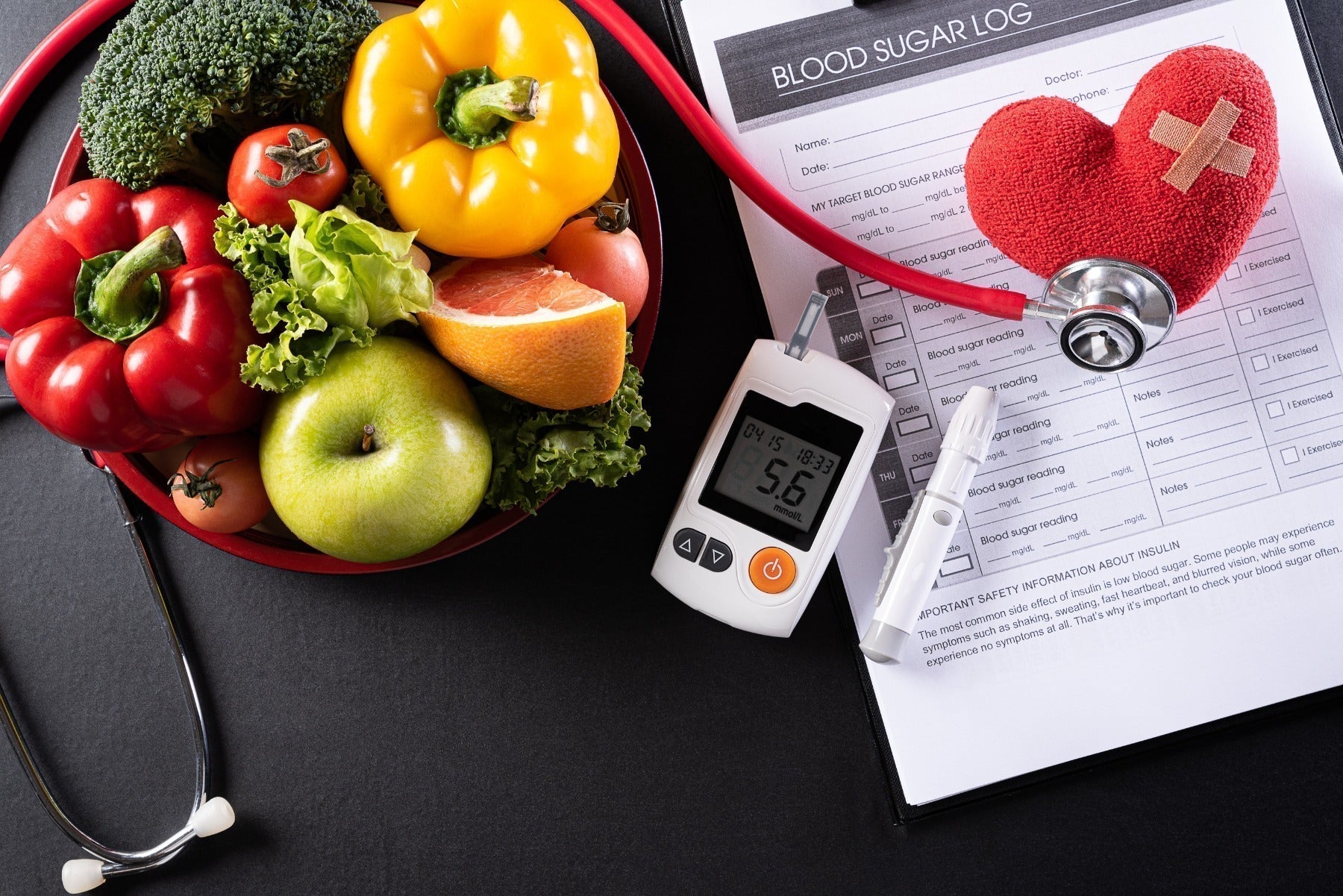 Patient's blood sugar control, diabetic measurement, and healthy food eating nutrition with red heart