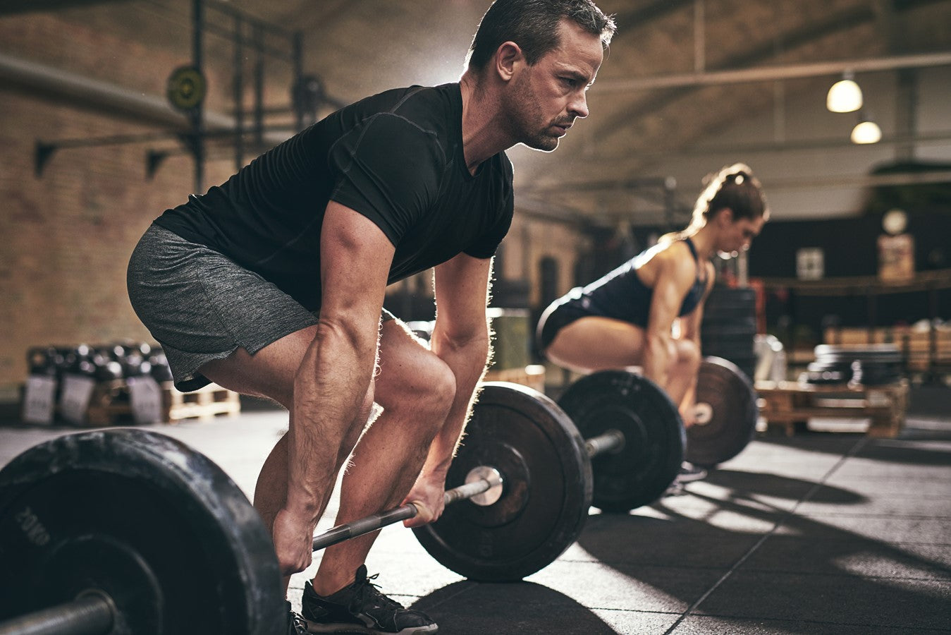 man and women working out