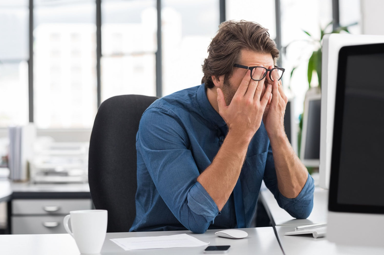 depressed man in office
