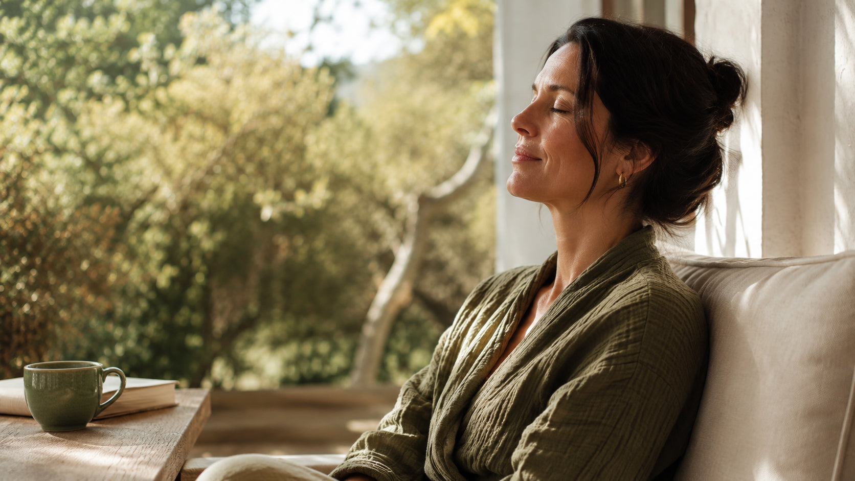 Person relaxing outdoors in natural light, calm and unposed